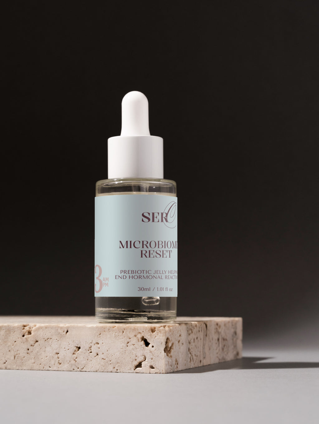 Microbiome Reset Serum applied to skin to strengthen and balance the skin barrier