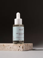 Microbiome Reset Serum applied to skin to strengthen and balance the skin barrier