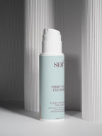 First Step oil-to-milk cleanser product packaging close-up by Face by SERO